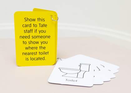 Yellow and white communication cards attached by a key ring